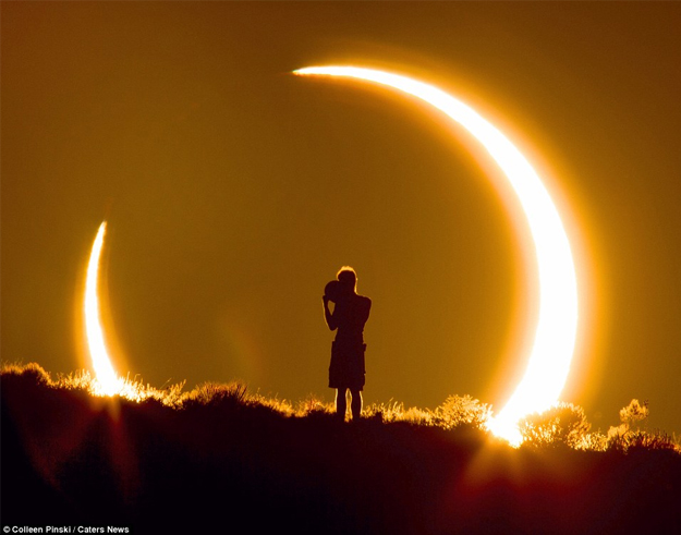 Impresionante instantánea de un niño viendo un eclipse siendo fotografiado a 2.3 km de distancia