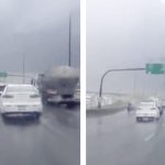 Señalización de tráfico es agitada violentamente durante una tormenta en Canadá