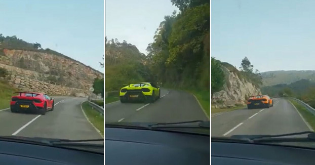 Una decena de Lamborghinis a la carrera en una carretera de Asturias